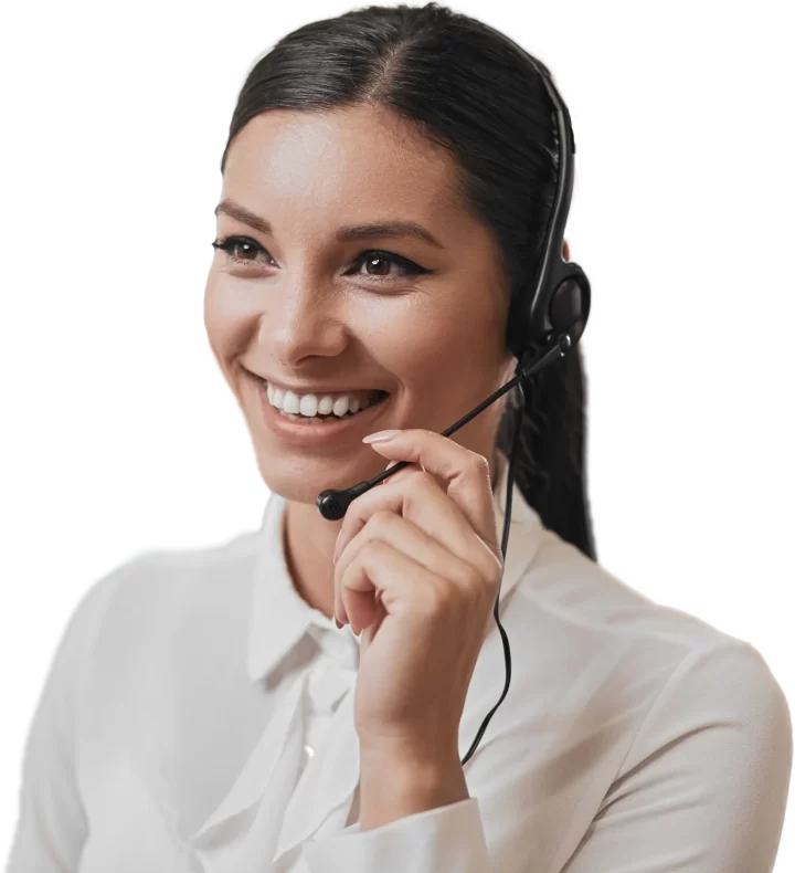 A support agent smiles on a call while adjusting her headset.